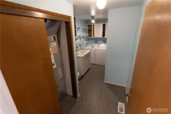 Laundry room, 1/2 bath, furnace, and storage