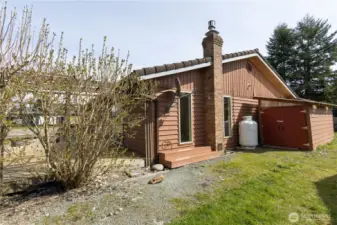 South side of the house with shed