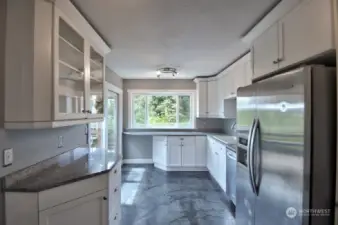 Updated kitchen with granite counters and solid cement/polymer/mesh-enforced heated floor