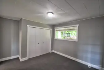 Sizeable front bedroom (possible primary) off of the living room with access to a full bathroom