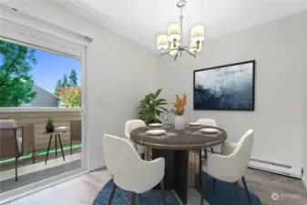 Light and bright dining room with access through sliders to the deck and adjacent to a pass-through to the kitchen.  Photo has been virtually staged.