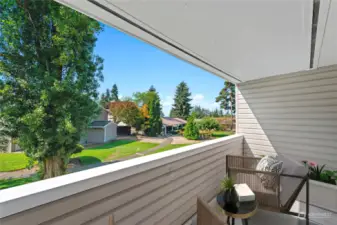 Relax and enjoy the view on this private deck.  Photo has been virtually staged.