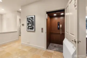 An elevator equipped with an internal phone enhances the main floor living experience, making it ideal for effortless accessibility, multigenerational living, or aging in place—all without compromising on style or convenience.