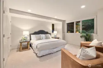 An oversized lower-level en-suite bedroom featuring a large closet and private bathroom, offering a perfect blend of comfort and privacy.