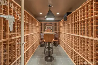 Custom-designed wine racks with climate control accommodate up to 1,400 bottles—an exceptional feature for the discerning collector.