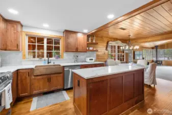 Recently updated kitchen with quartz countertops, copper sink, and stainless steel appliances.