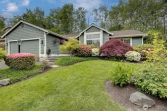 Exceptional curb appeal with manicured landscaping