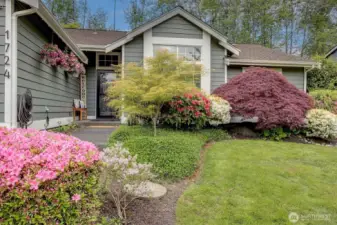 Blooming perennials line inviting entryway