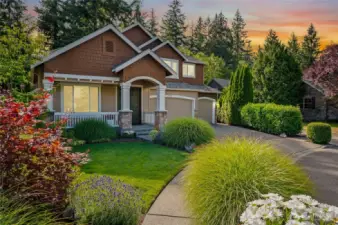 Elegant curb appeal with manicured landscaping.