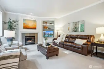 Cozy up in the inviting family room with built-ins and 2nd gas fireplace.