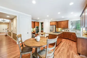 Bright, open-concept kitchen with granite counters.