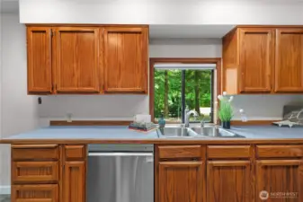 Kitchen looks to the u - shaped driveway