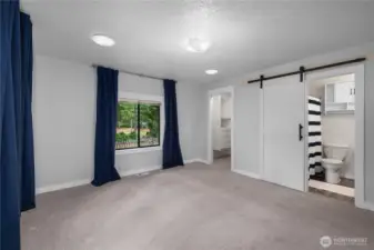 Barn door open to the full bath