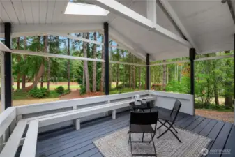 Back covered deck for year round entertaining and lots of built in seating.