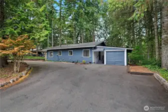 Driveway that brings you to the garage. RV parking or boat parking would work easy with the u-shape.