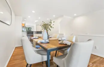 Dining room with the kitchen in the background.