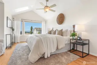Primary suite with westerly views, vaulted ceilings, hardwood floors.