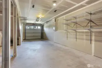 The garage could fit two smaller vehicles (tandem), and has plenty of room for gear storage.