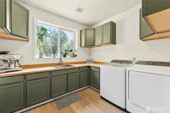 Huge laundry room w/additional fridge.