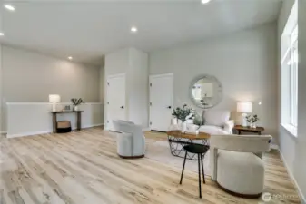 Downstairs you'll find two additional bedrooms, a full bath and laundry areas
