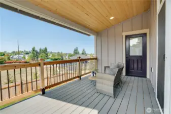 This covered private balcony lets you relax and watch the world go by.