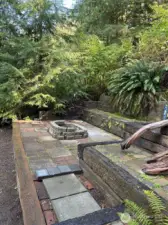 Patio area with built-in firepit.
