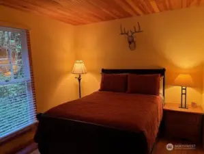 2nd bedroom with calming, restful design and colors.