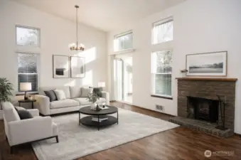 Virtually staged gorgeous living room with vaulted ceilings and large windows!
