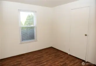 Vacant third bedroom and closet.