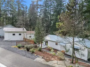 Wide view of home and garage from the street