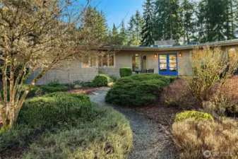 The landscaping was done with an artist's eye; evergreen shrubs for structure, lavenders and perennials for summer splash and small trees and shrubs for extra year-round interest. This garden delights in all seasons.