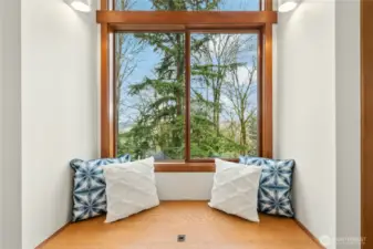 Extra storage and window seat in primary bedroom.