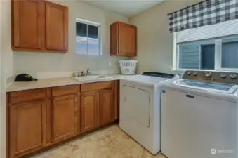 Laundry room located on the upper level.