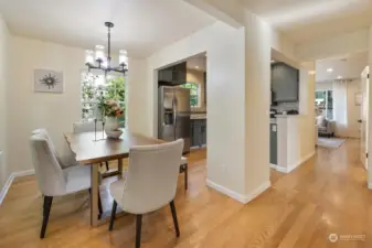 Hardwood floors continue from living to dining room through to the kitchen for a seamless transition from room to room.