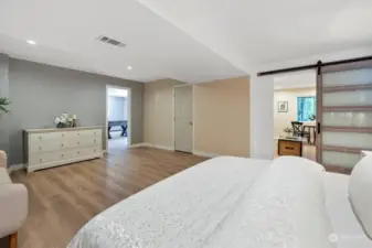 Sliding accent door separates living space from bonus/bedroom.