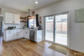 Corner of kitchen with plenty of room for an island or table if you like. Sliders lead to porch just to side of home