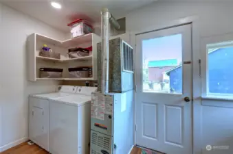 One corner of Laundry/utility room. Door leads to back yard. This is a perfect area for shedding muddy boots and corralling wet pets!