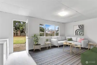 Bonus room with laundry area opens out to spacious yard.