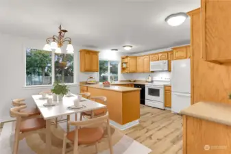 Dining space is conveniently located near the kitchen. Pantry with pull-out shelves is on the right wall.