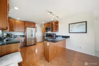 Door off of the kitchen leads to the basement rec room