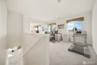 Primary bedroom sitting area with multiple uses