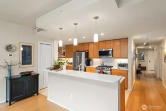 The Kitchen features Granite Counters, Stainless Steel Appliances (including brand-new Bosch Dishwasher), Gas Range, Tile Flooring, and updated Bamboo Cabinets.