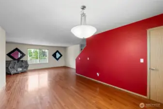 This view highlights the impressive scale of the combined living and dining area, offering ample space for both everyday living and entertaining.