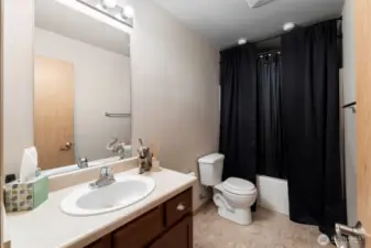 Spacious full guest bathroom located on the upper level, offering privacy and convenience with a central location.