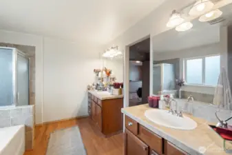 The private ensuite bathroom boasts two separate vanities, offering added convenience and personal space.