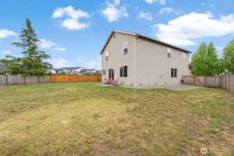 The spacious backyard is fully fenced, providing a blank canvas ready for your vision and outdoor plans.