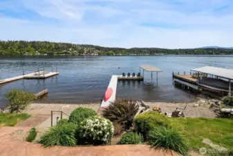 Massive newer dock with boat canopy and lift.