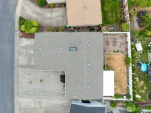 Aerial view showcasing the home’s composition roof that's only 8 years old, low-maintenance front yard and private fenced backyard.
