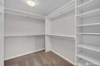 Custom shelving in primary walk-in closet