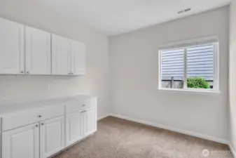 Main floor bonus room. Built-ins stay. Currently used as office.
